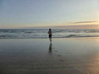 Swimming off all that pizza down at Dinas Dinlle